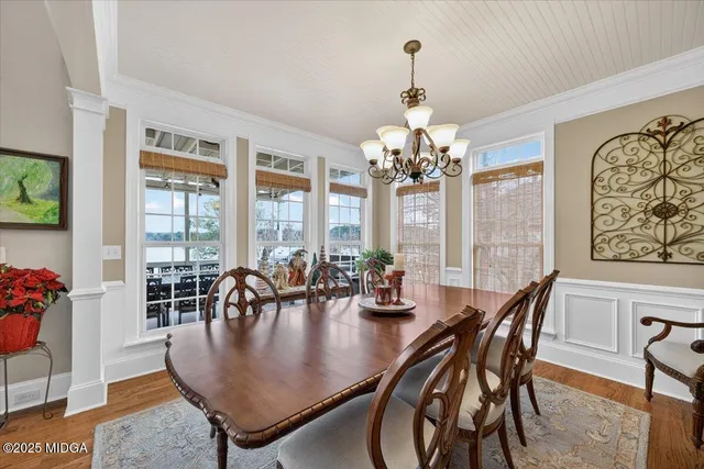 a bedroom with a bed and a chair