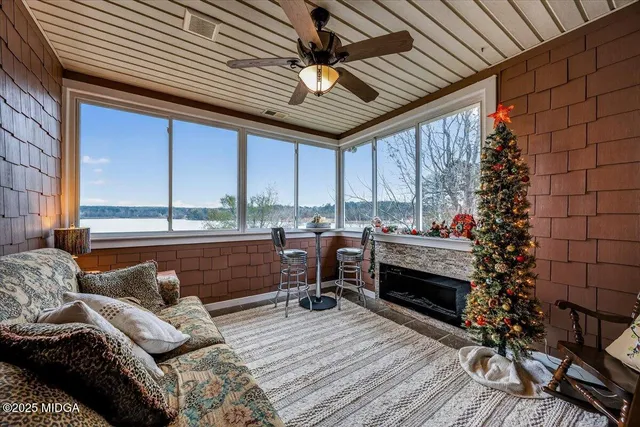 a living room with furniture a window and kitchen view