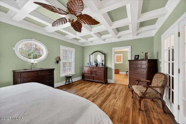 a view of a house with yard and lake view