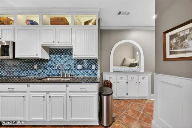 an aerial view of a house with a lake view