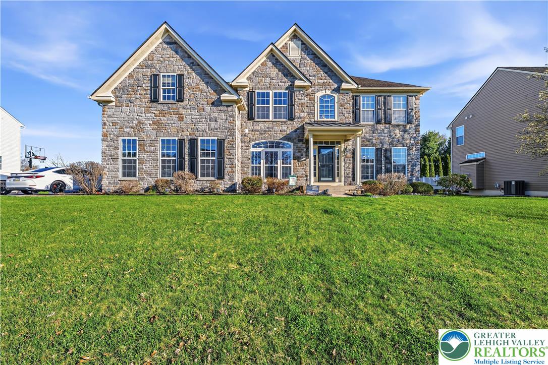 130 Lower Way Road Easton, PA 18045 - Photo 2 of 56 a front view of a house with a yard and trees