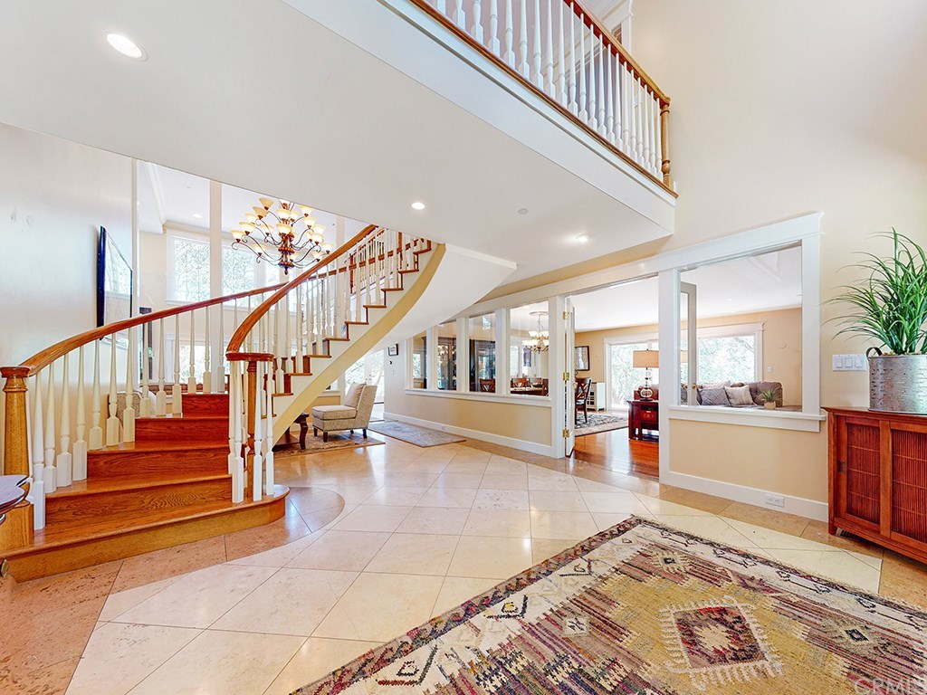 14199 Morro Road Atascadero, CA 93422 - Photo 4 of 73 Front entry, Travertine floors with inlaid borders, open spiral staircase with dramatic 20' ceilings.
