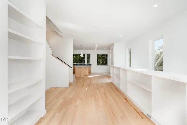 a view of a living room with wooden floor