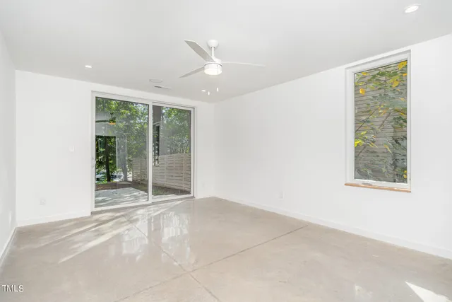 a view of an empty room with a window