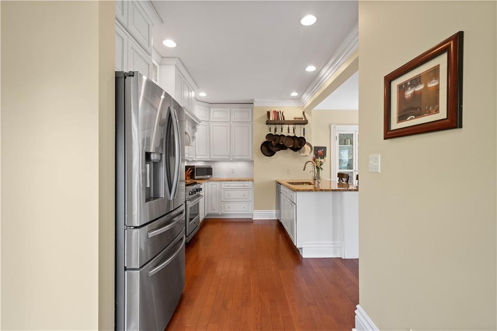 607 Broad Street Sewickley, PA 15143 - Photo 15 of 45 a kitchen with stainless steel appliances a refrigerator and a stove