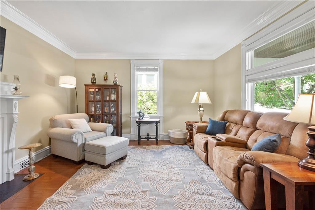 607 Broad Street Sewickley, PA 15143 - Photo 16 of 45 a living room with furniture and a large window