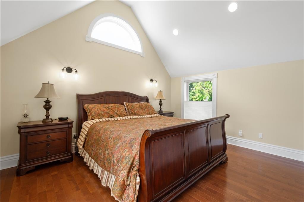 607 Broad Street Sewickley, PA 15143 - Photo 20 of 45 a bedroom with a bed and a dresser