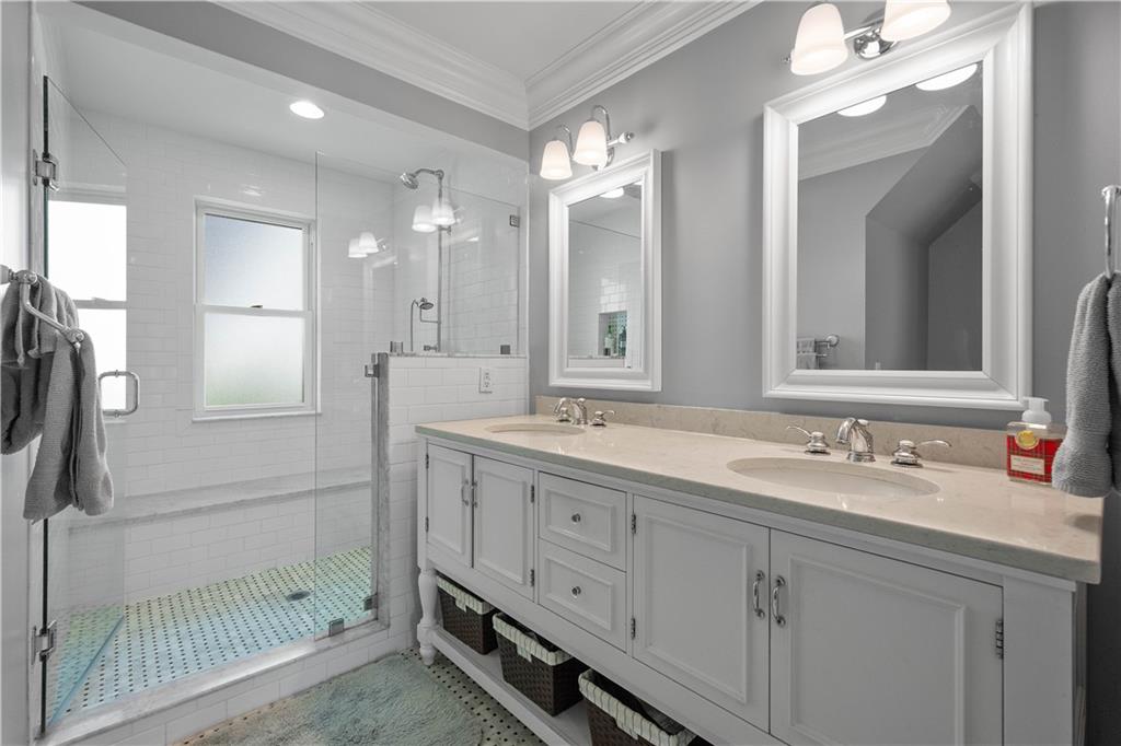 607 Broad Street Sewickley, PA 15143 - Photo 22 of 45 a bathroom with a double vanity sink and a mirror