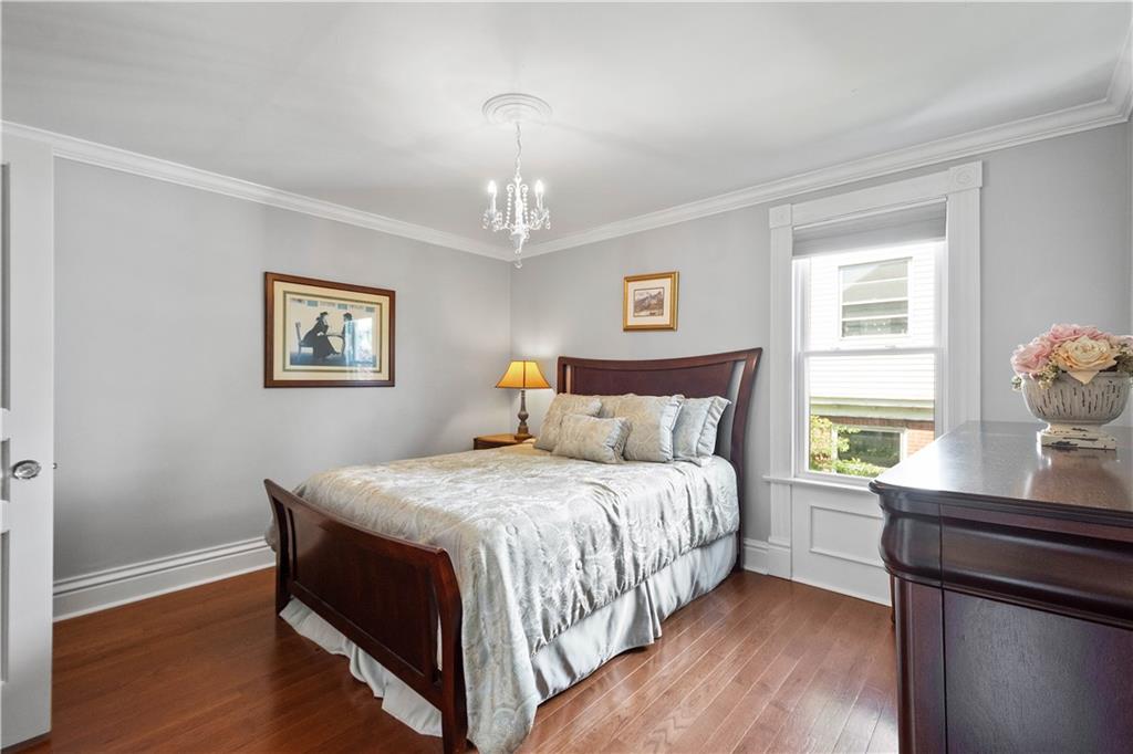607 Broad Street Sewickley, PA 15143 - Photo 25 of 45 a bedroom with a bed and a window