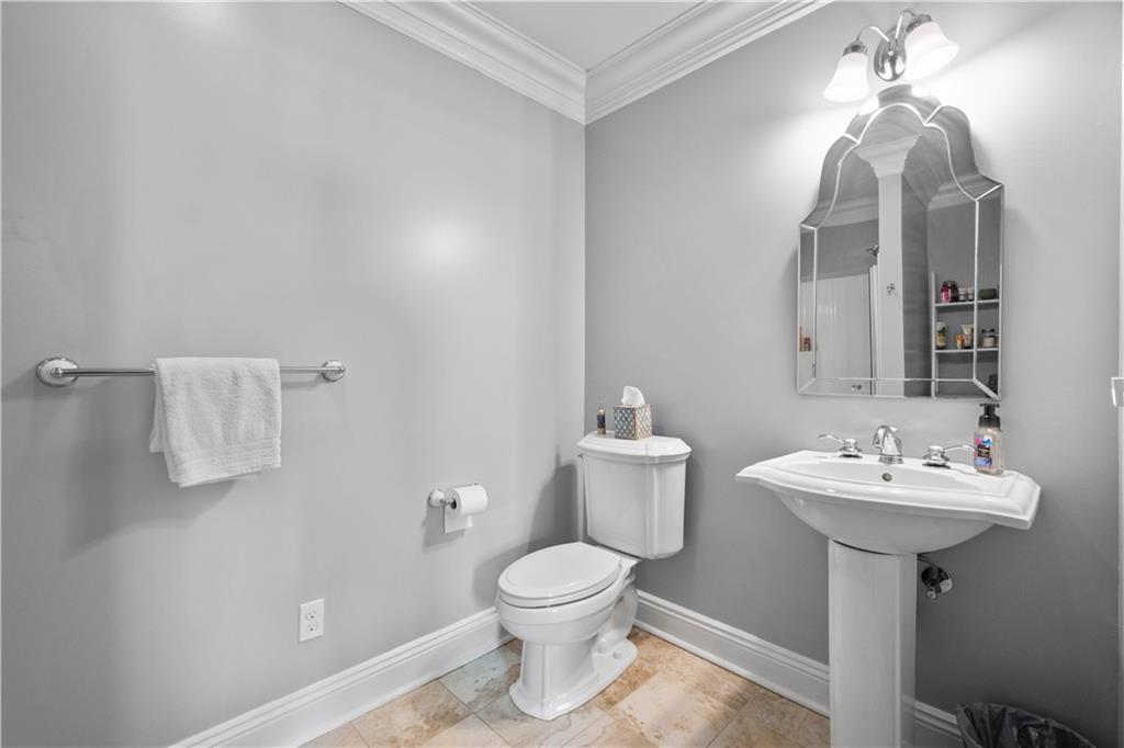 607 Broad Street Sewickley, PA 15143 - Photo 27 of 45 a bathroom with a toilet sink and mirror