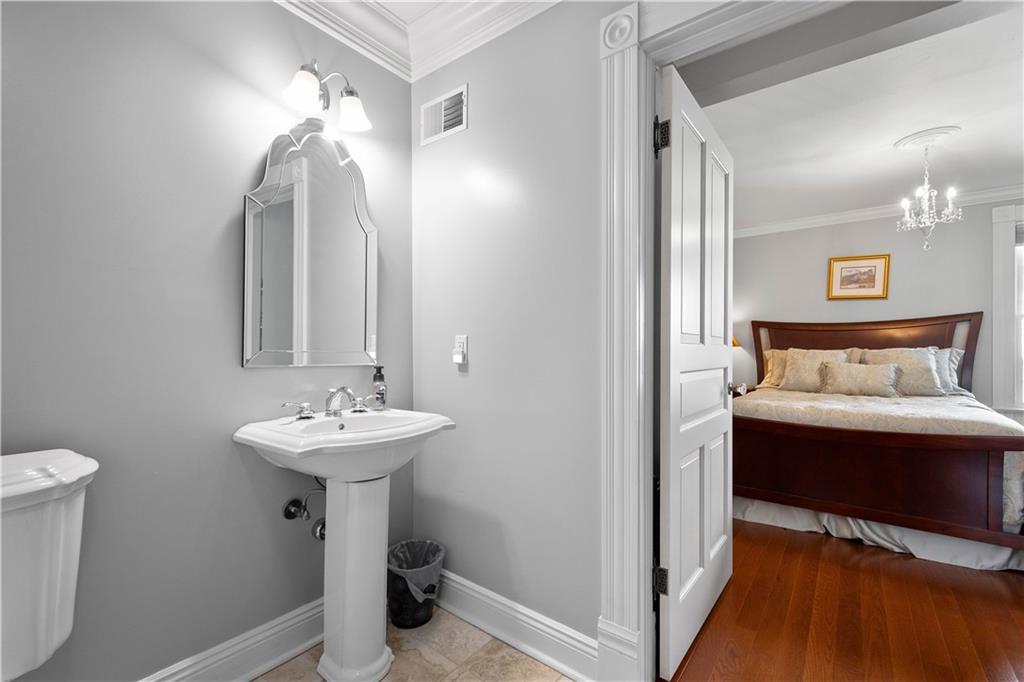 607 Broad Street Sewickley, PA 15143 - Photo 28 of 45 a bathroom with a sink and a mirror