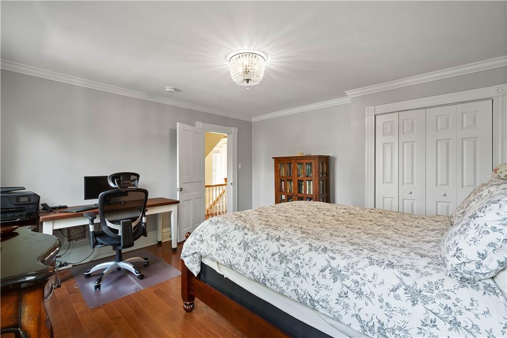 607 Broad Street Sewickley, PA 15143 - Photo 30 of 45 a bedroom with a bed and a desk