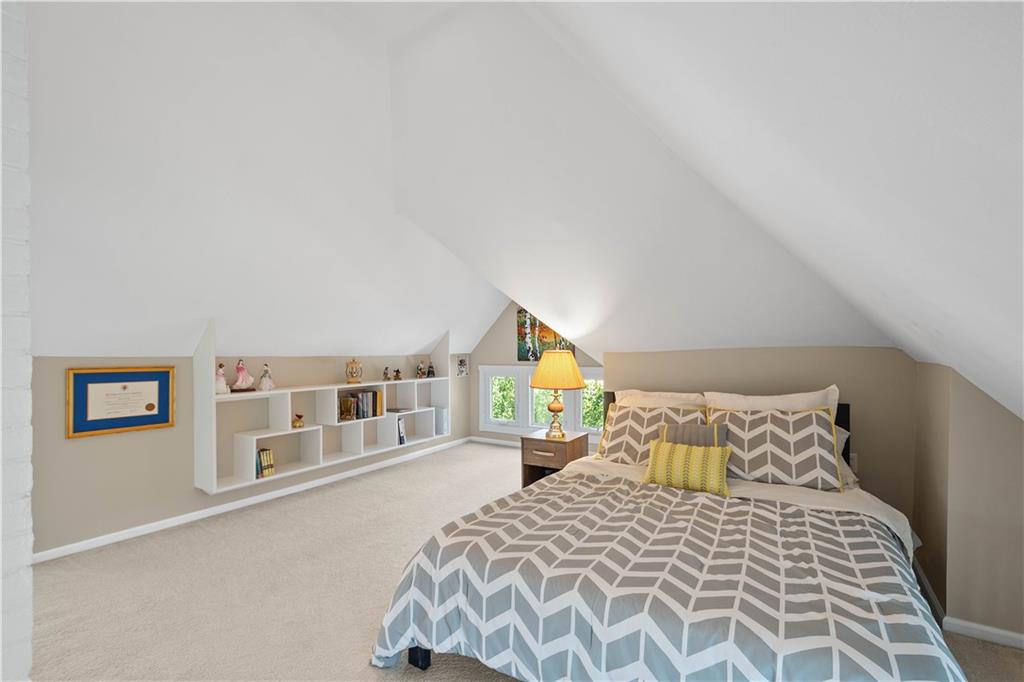 607 Broad Street Sewickley, PA 15143 - Photo 34 of 45 a bedroom with a bed and a window