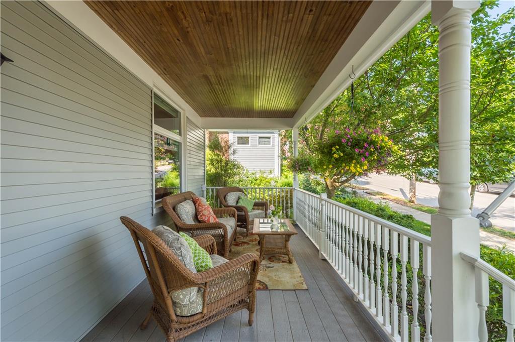 607 Broad Street Sewickley, PA 15143 - Photo 35 of 45 a view of a porch with furniture and wooden floor