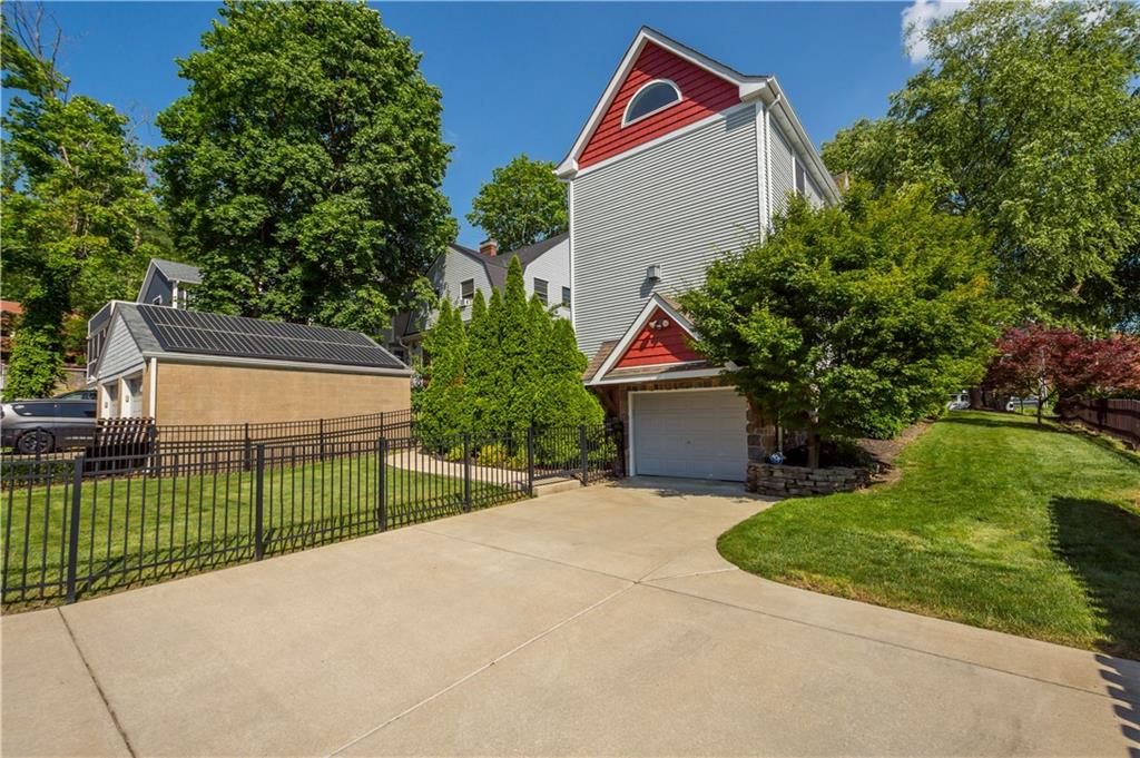 607 Broad Street Sewickley, PA 15143 - Photo 36 of 45 a front view of a house with garage