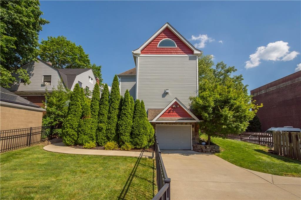 607 Broad Street Sewickley, PA 15143 - Photo 37 of 45 a front view of a house with garden