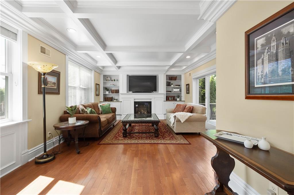 607 Broad Street Sewickley, PA 15143 - Photo 5 of 45 a living room with furniture and a fireplace