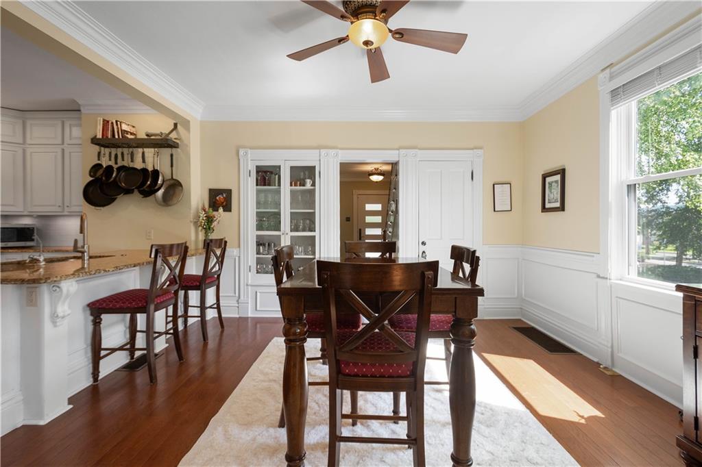 607 Broad Street Sewickley, PA 15143 - Photo 8 of 45 a view of a dining room with furniture and a window
