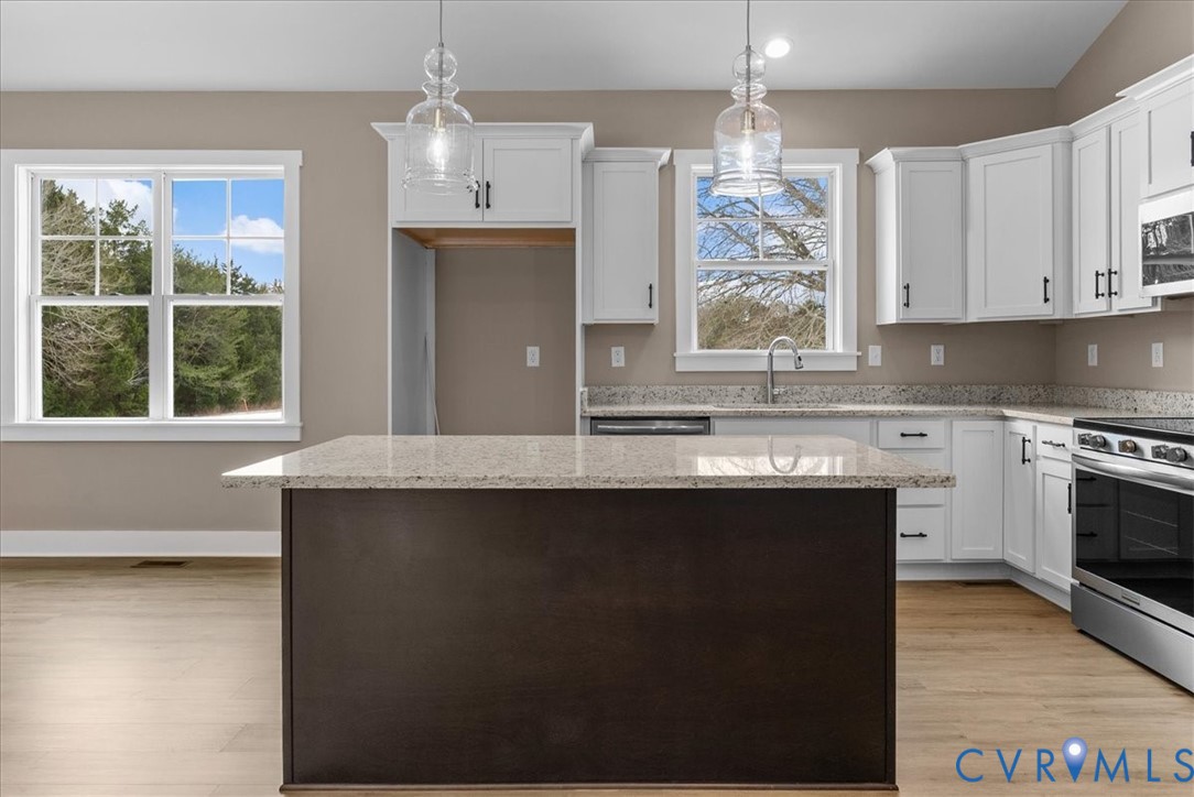 2229 North Terry's Bridge Road Halifax, VA 24558 - Photo 16 of 42 a kitchen with stainless steel appliances granite countertop a coffee maker a sink a counter space and cabinets