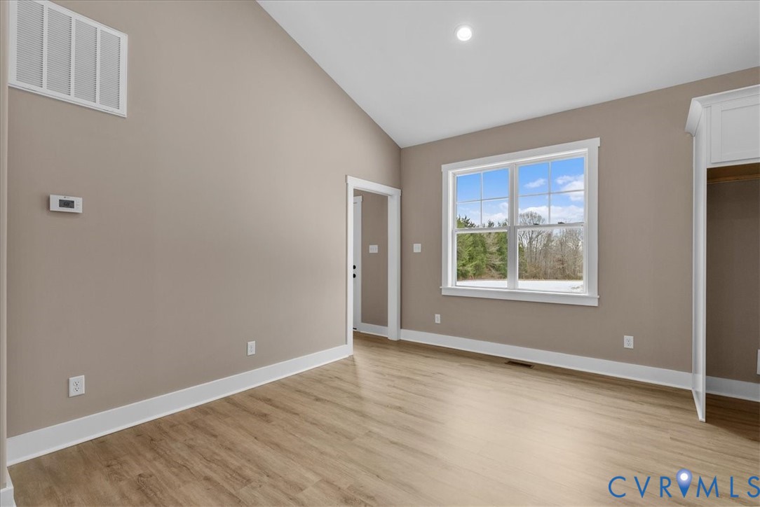 2229 North Terry's Bridge Road Halifax, VA 24558 - Photo 22 of 42 an empty room with wooden floor and windows