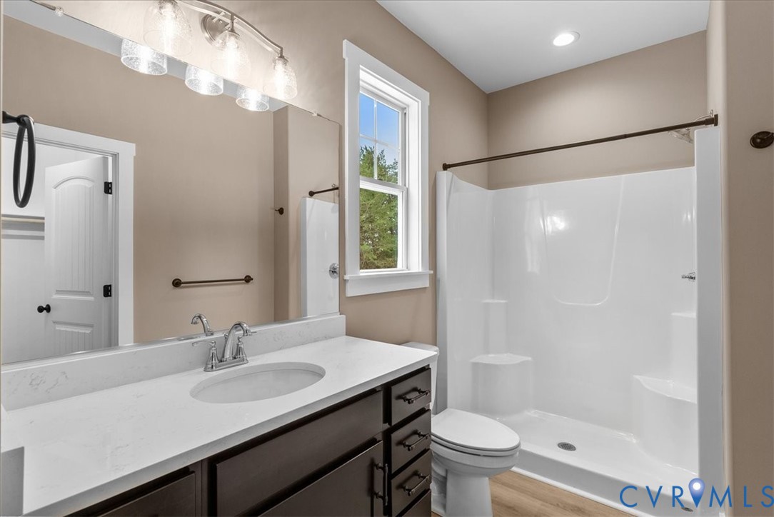 2229 North Terry's Bridge Road Halifax, VA 24558 - Photo 30 of 42 a bathroom with a sink toilet a mirror and shower