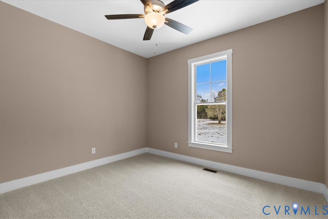 2229 North Terry's Bridge Road Halifax, VA 24558 - Photo 34 of 42 an empty room with a window and a ceiling fan