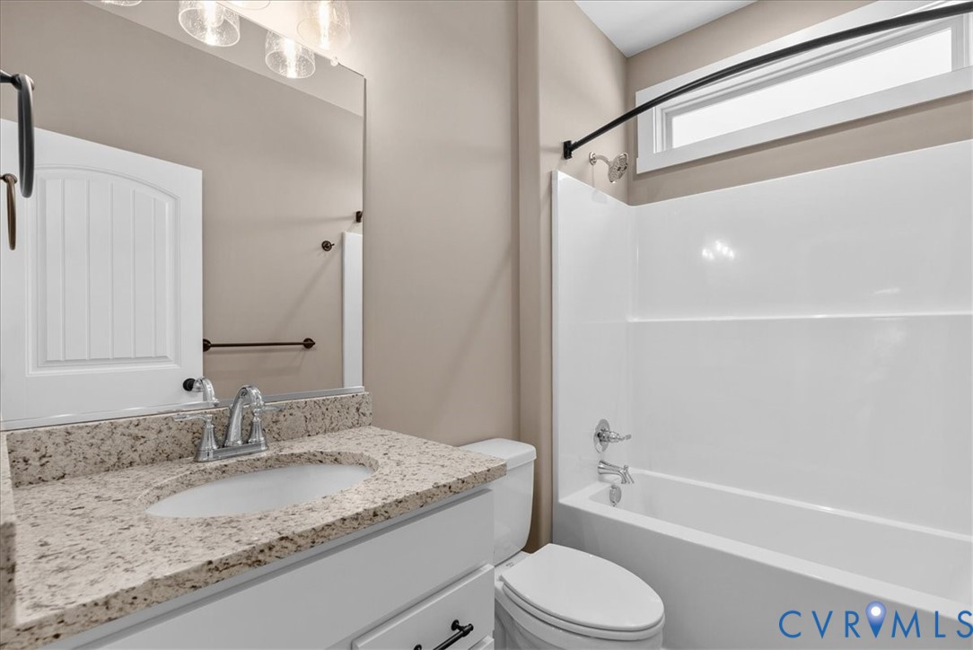 2229 North Terry's Bridge Road Halifax, VA 24558 - Photo 36 of 42 a bathroom with a granite countertop sink toilet and shower