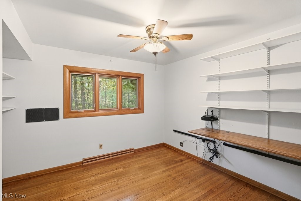 8304 Montello Road Independence, OH 44131 - Photo 17 of 45 Bedroom 4 with hardwood flooring and built in hinged desk