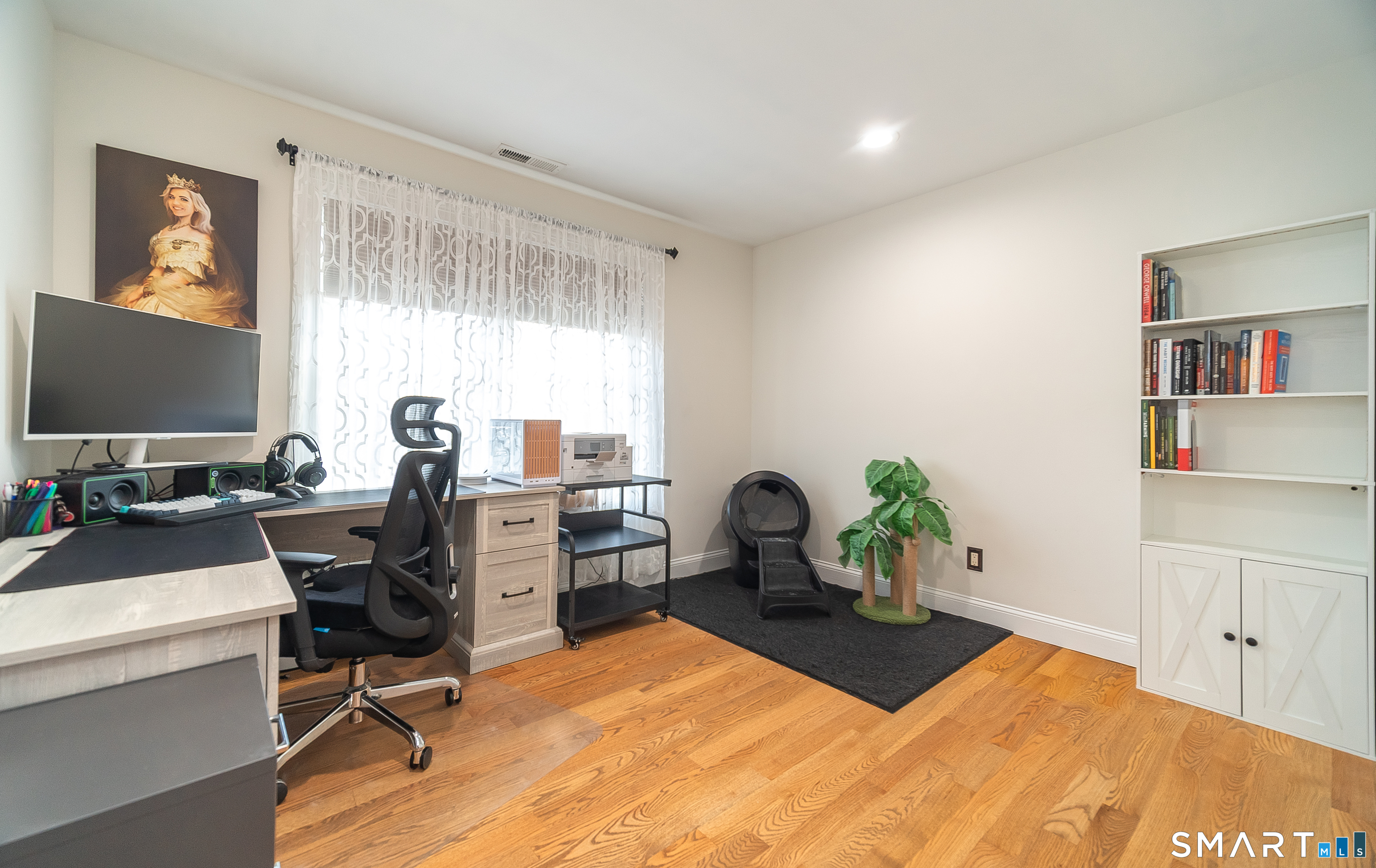69 Cronin Street Bristol, CT 06010 - Photo 16 of 40 a view of a workspace with furniture and a window