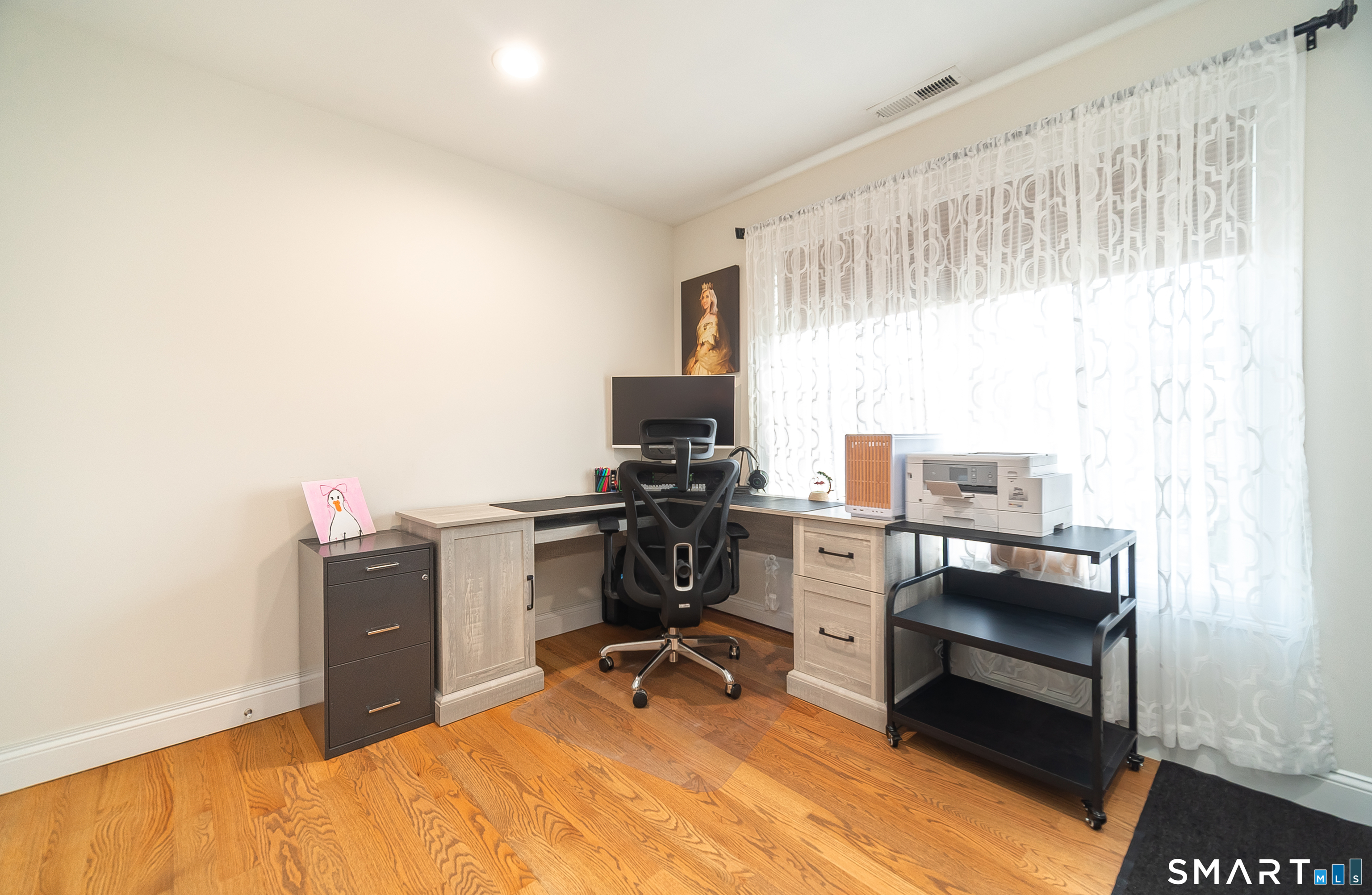 69 Cronin Street Bristol, CT 06010 - Photo 17 of 40 a view of a workspace with furniture and a window