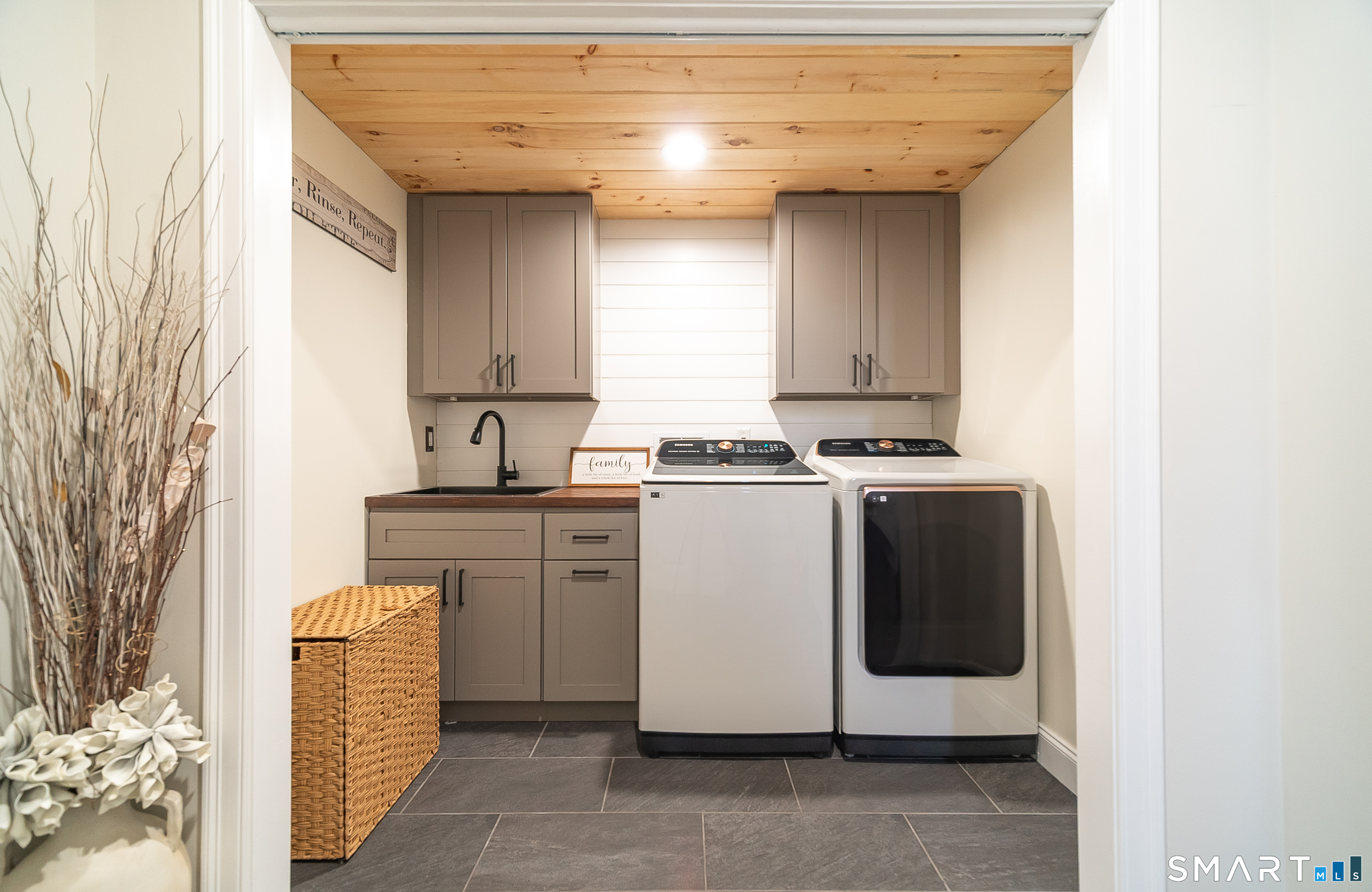 69 Cronin Street Bristol, CT 06010 - Photo 20 of 40 a kitchen with cabinets appliances and a window