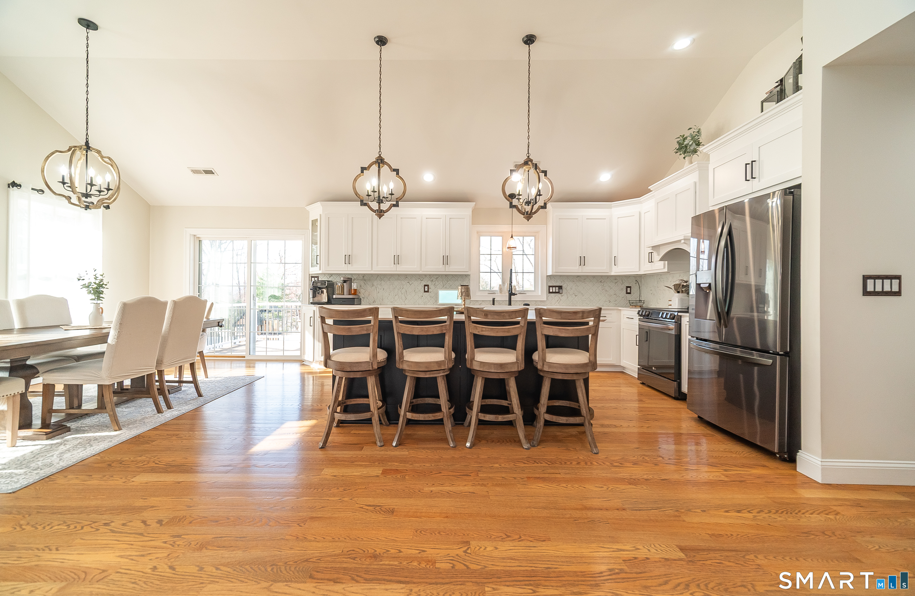 69 Cronin Street Bristol, CT 06010 - Photo 2 of 40 a large kitchen with a table and chairs