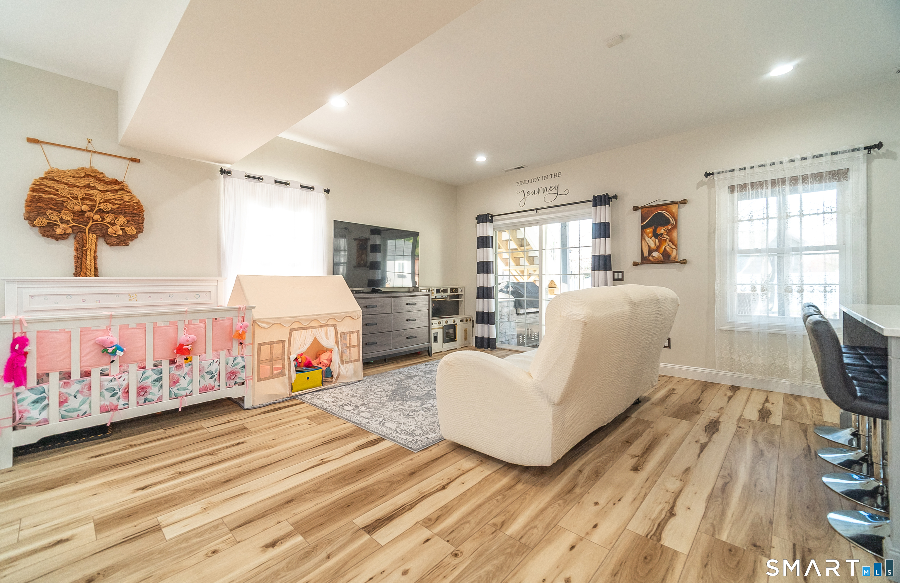 69 Cronin Street Bristol, CT 06010 - Photo 21 of 40 a living room with furniture and a flat screen tv