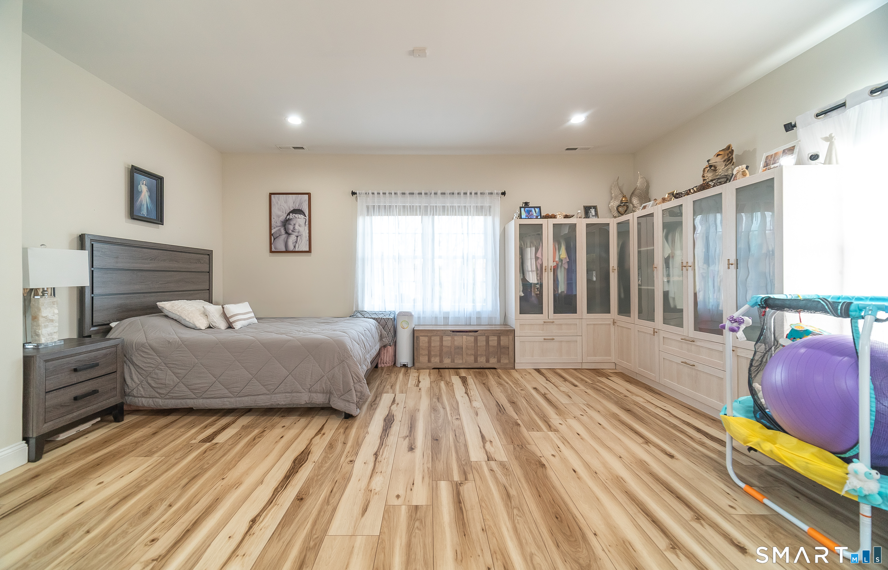 69 Cronin Street Bristol, CT 06010 - Photo 24 of 40 a spacious bedroom with a bed and window