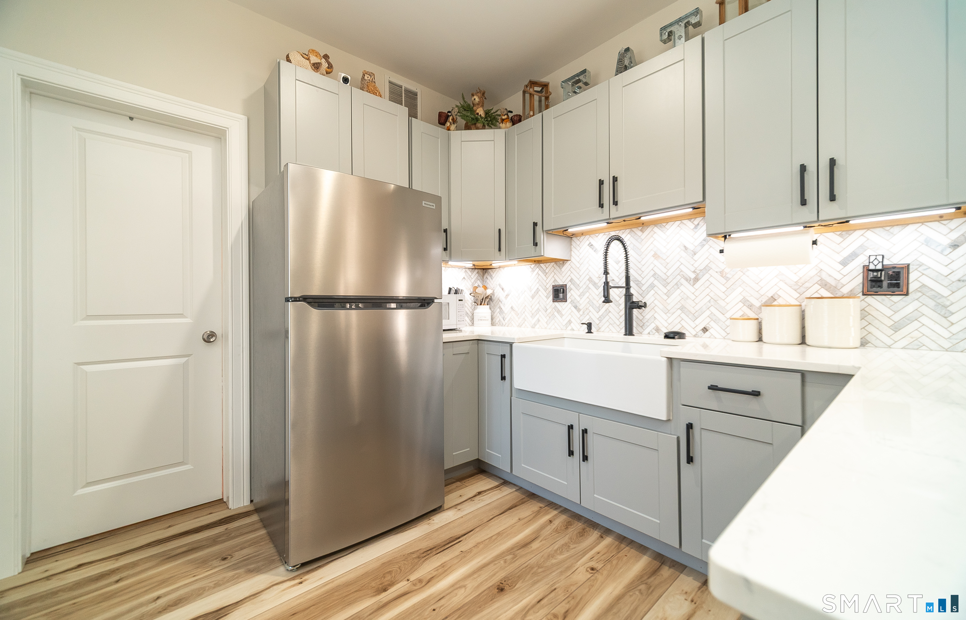 69 Cronin Street Bristol, CT 06010 - Photo 26 of 40 a kitchen with appliances a sink and cabinets