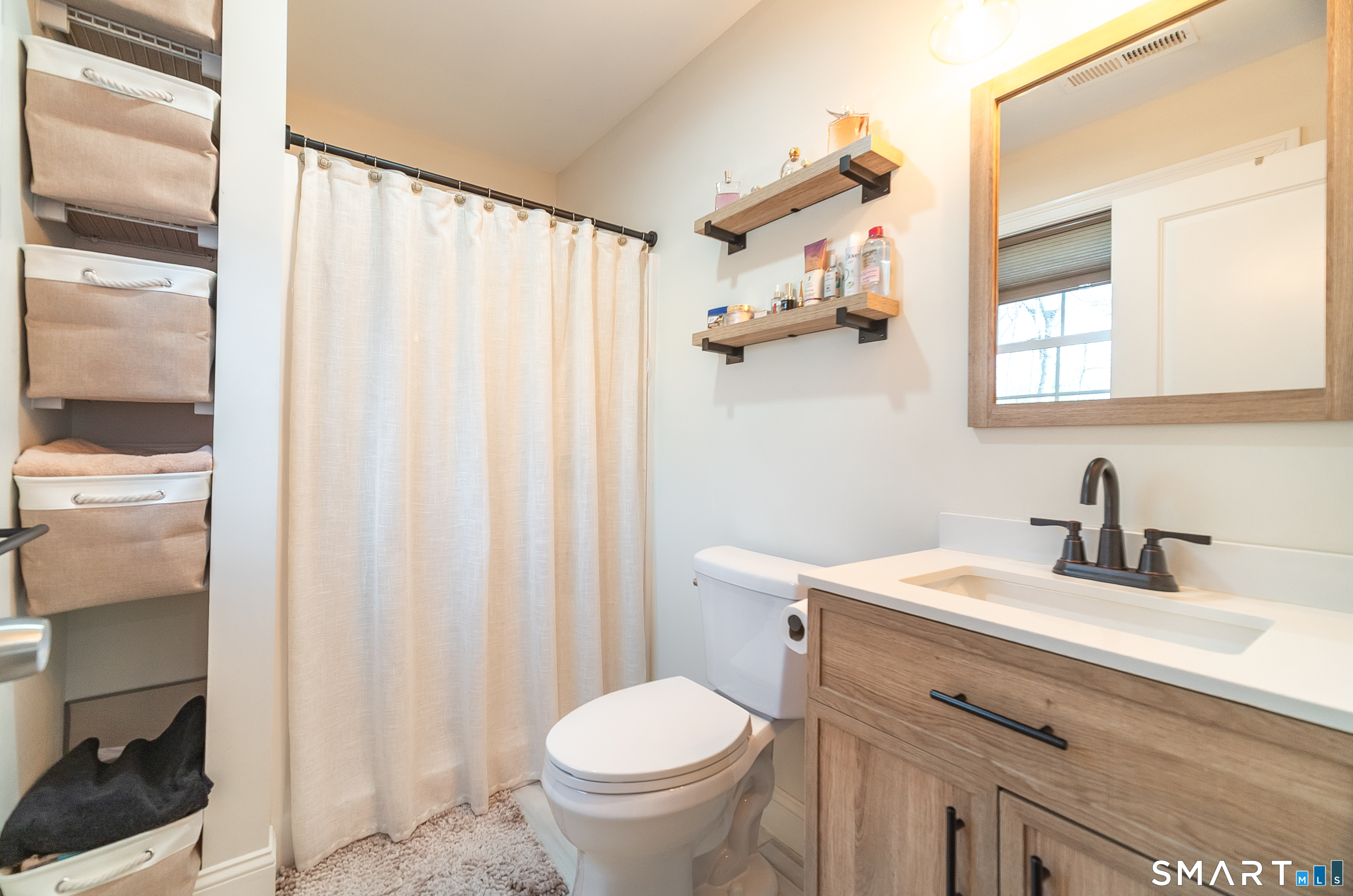 69 Cronin Street Bristol, CT 06010 - Photo 27 of 40 a bathroom with a sink toilet and shower