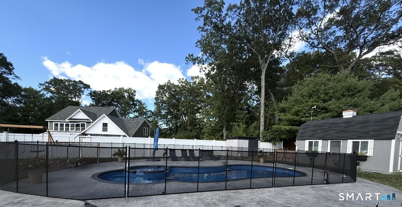 69 Cronin Street Bristol, CT 06010 - Photo 33 of 40 a view of house with outdoor seating and city view