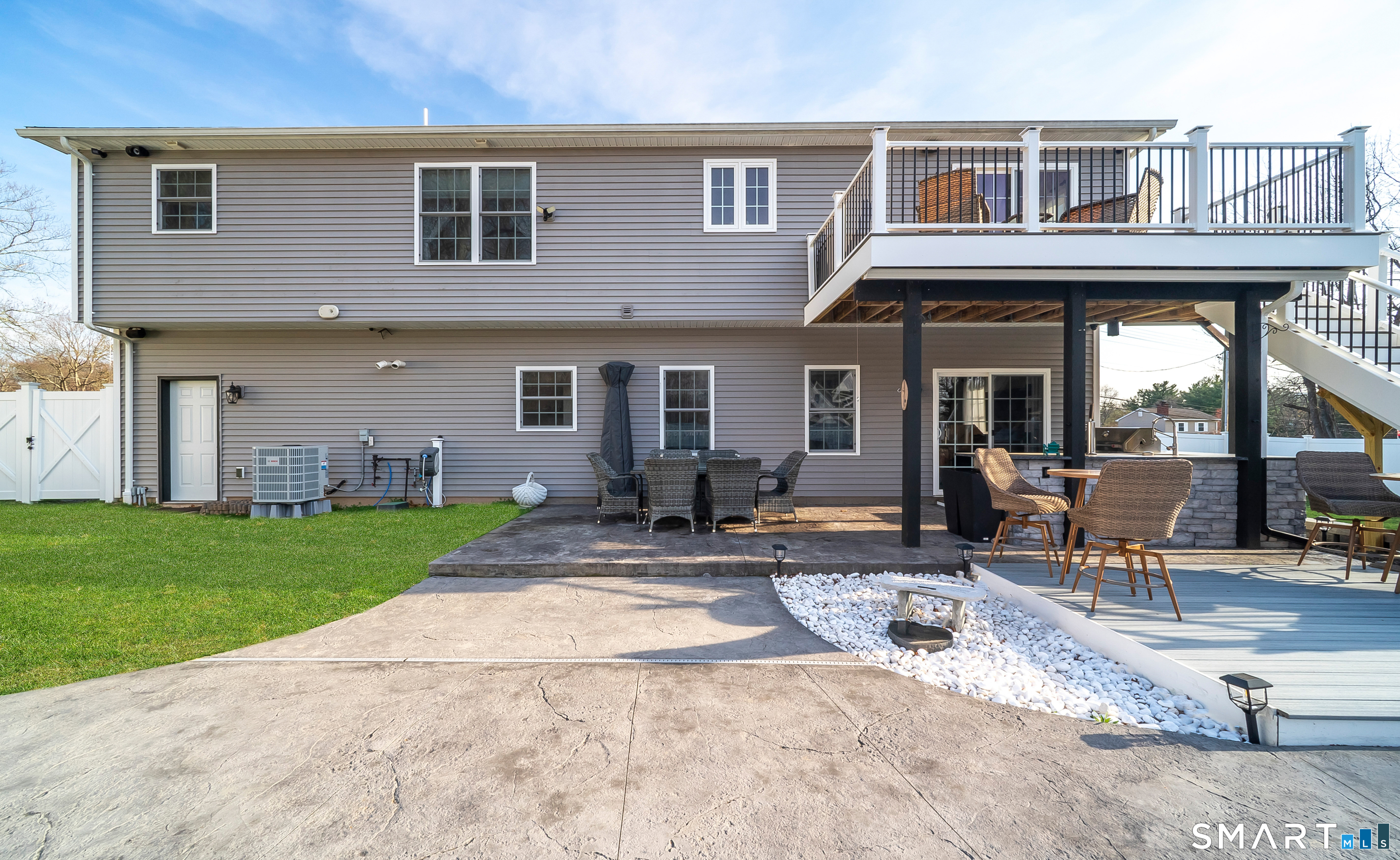 69 Cronin Street Bristol, CT 06010 - Photo 37 of 40 a view of a house with backyard porch and sitting area