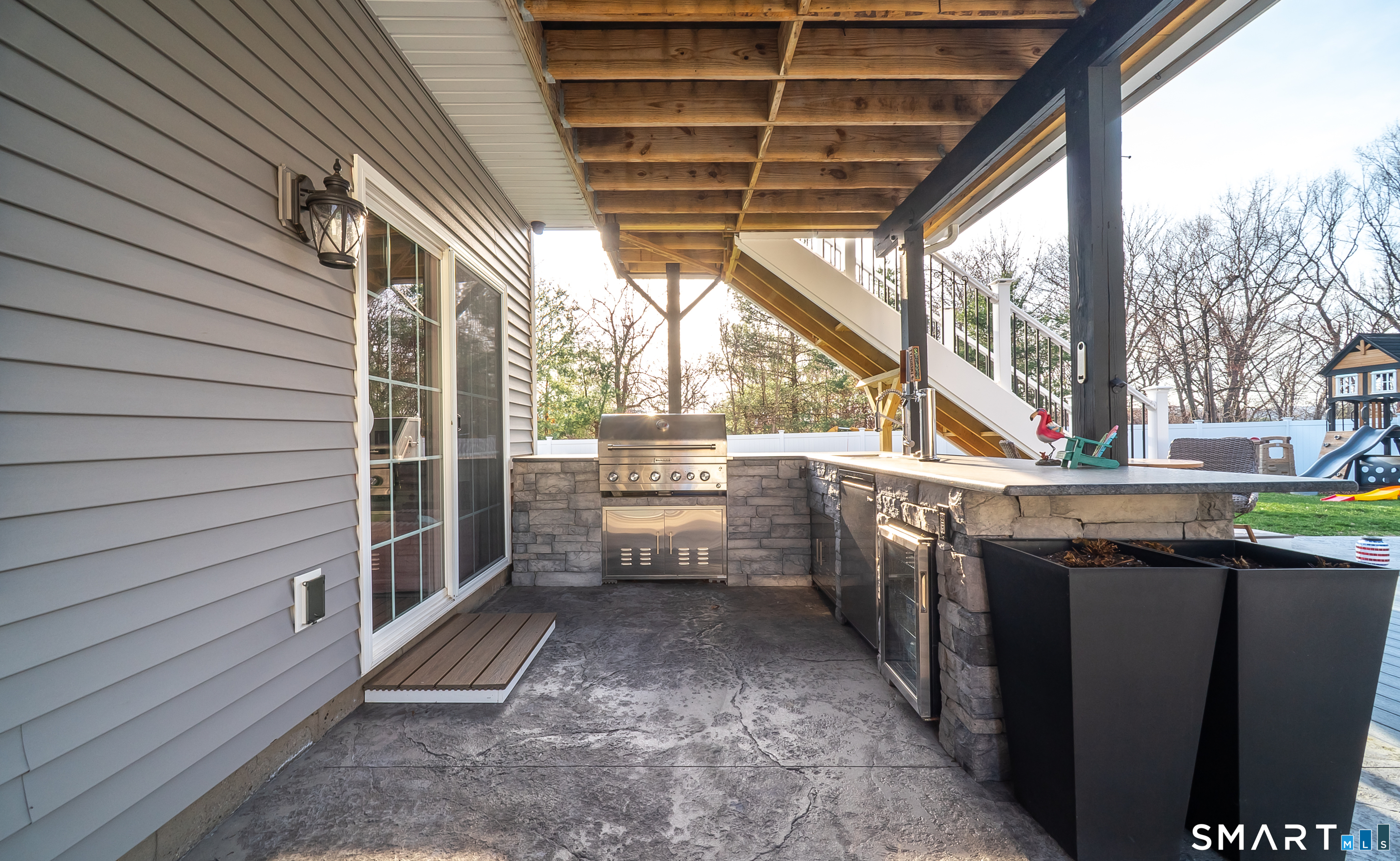 69 Cronin Street Bristol, CT 06010 - Photo 38 of 40 a view of a porch with wooden floor and iron stairs