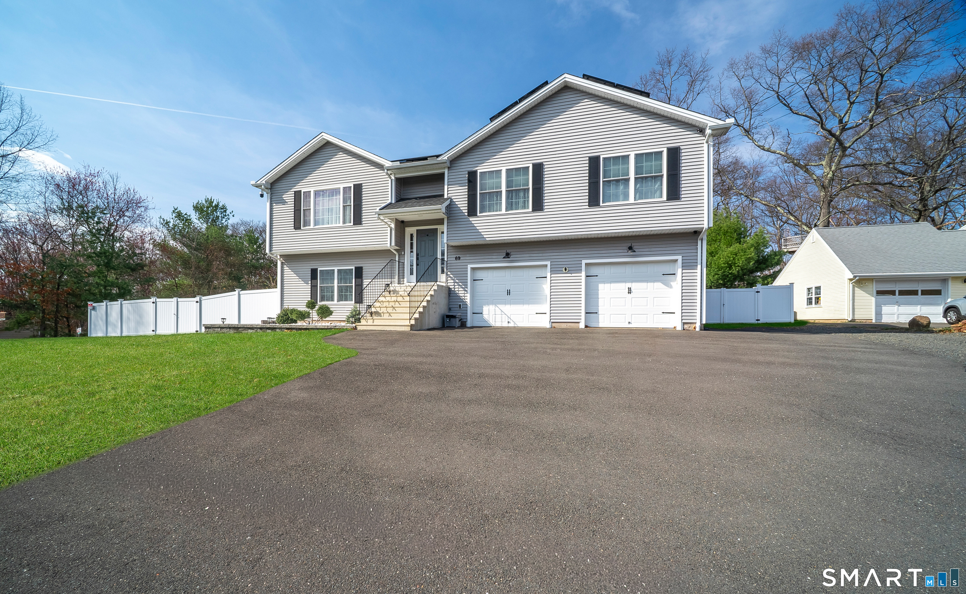 69 Cronin Street Bristol, CT 06010 - Photo 39 of 40 a view of house with yard and garage