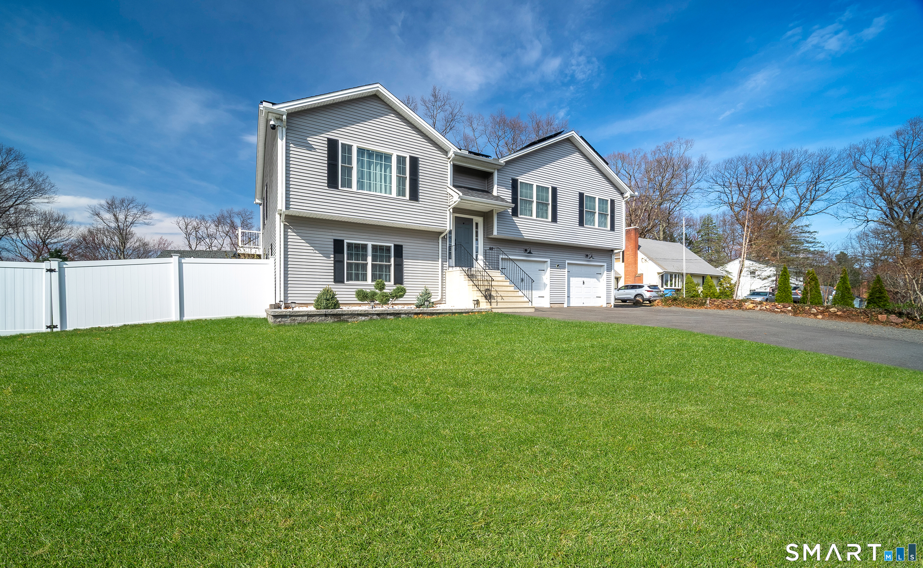 69 Cronin Street Bristol, CT 06010 - Photo 40 of 40 a front view of a house with a garden and yard
