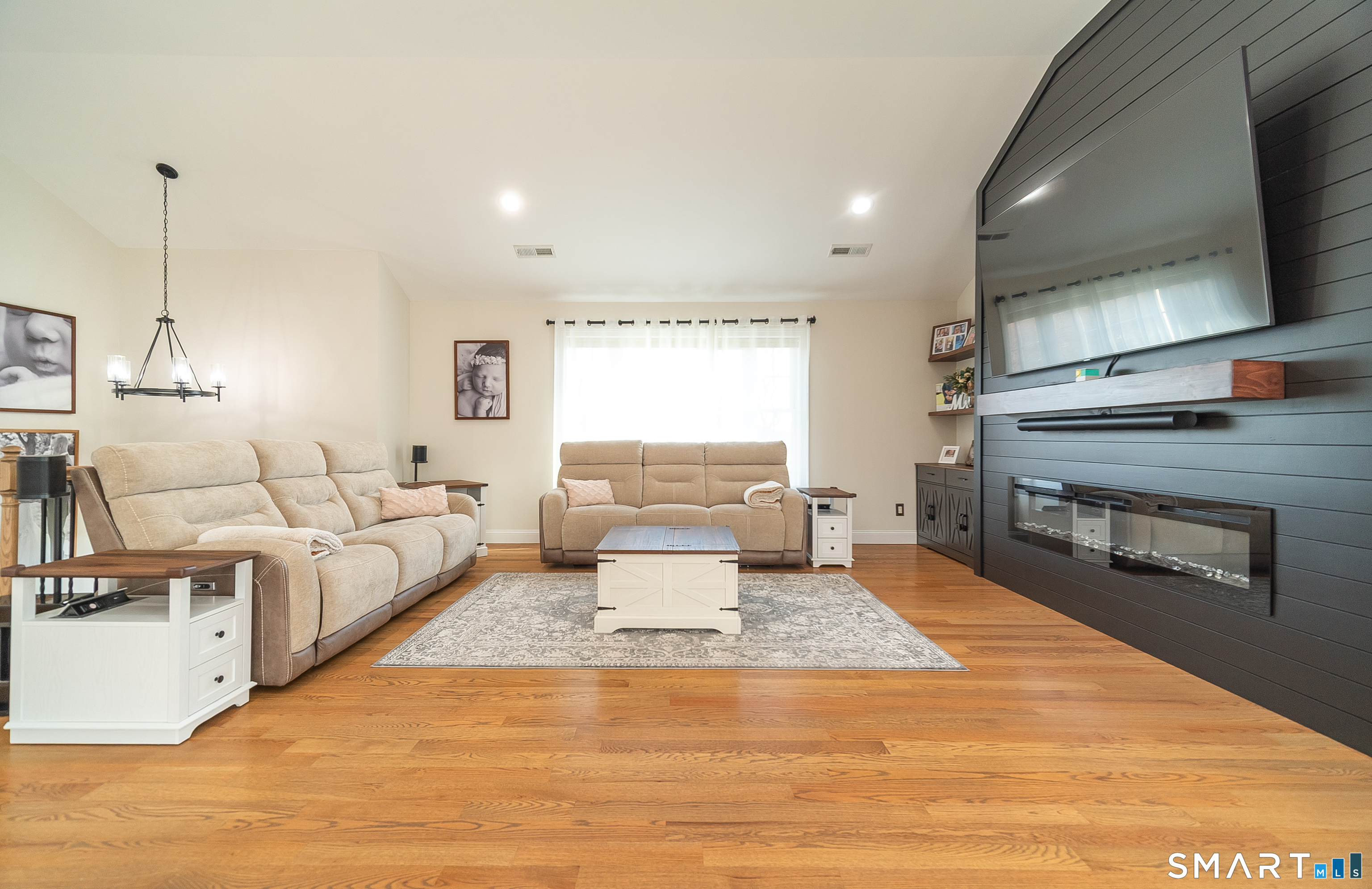 69 Cronin Street Bristol, CT 06010 - Photo 6 of 40 a living room with furniture and a flat screen tv