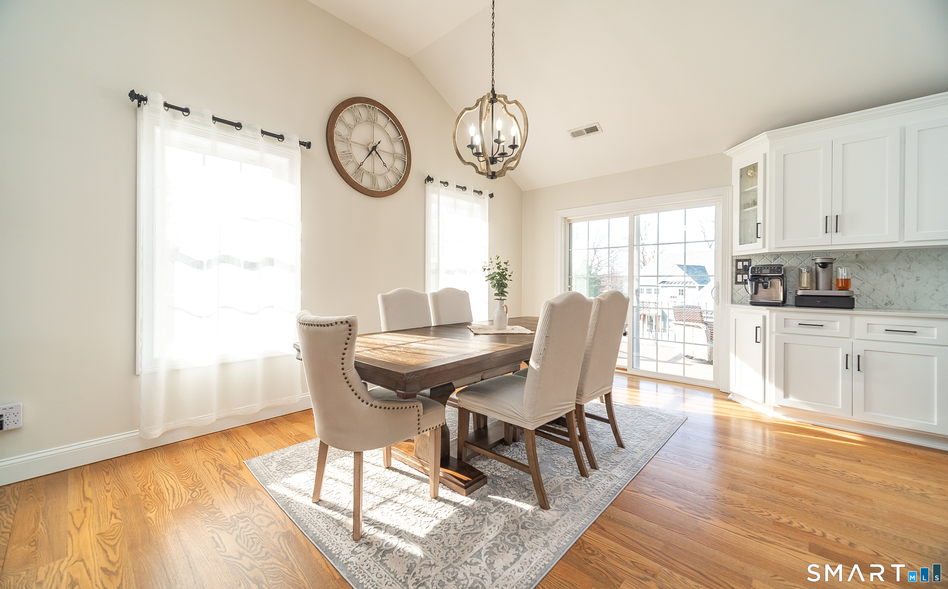 69 Cronin Street Bristol, CT 06010 - Photo 7 of 40 a view of a dining room with furniture window and wooden floor