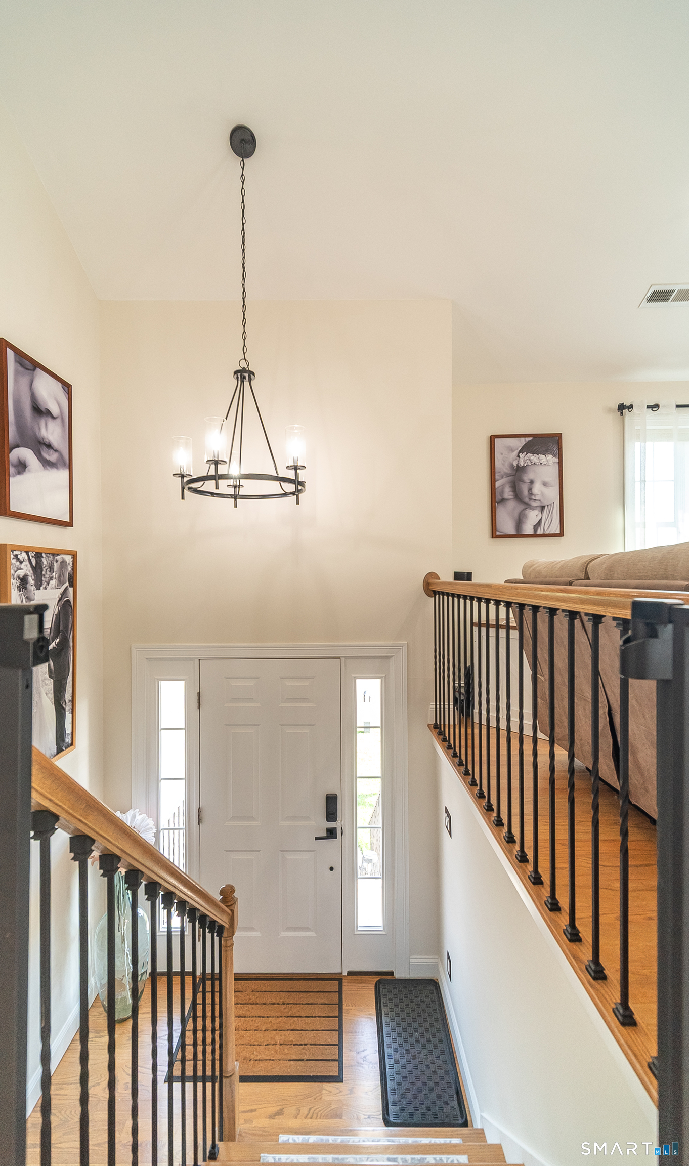 69 Cronin Street Bristol, CT 06010 - Photo 9 of 40 a view of a hallway with windows