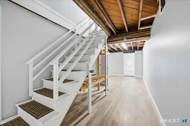 a view of entryway with wooden floor