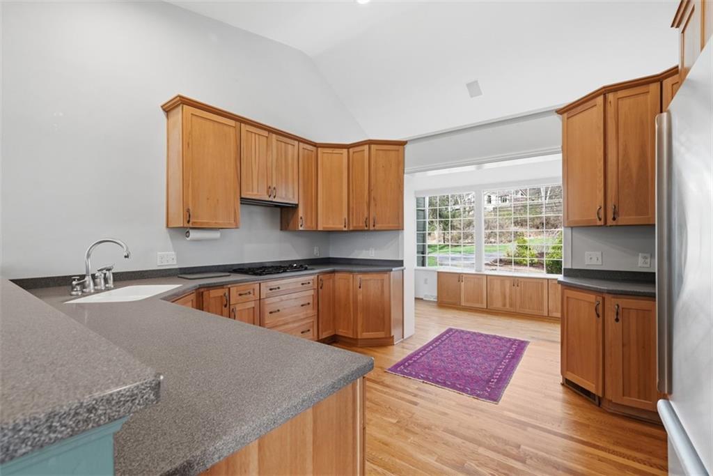 1001 Fox Chapel Road Pittsburgh, PA 15238 - Photo 12 of 50 a kitchen with stainless steel appliances granite countertop a sink stove and refrigerator
