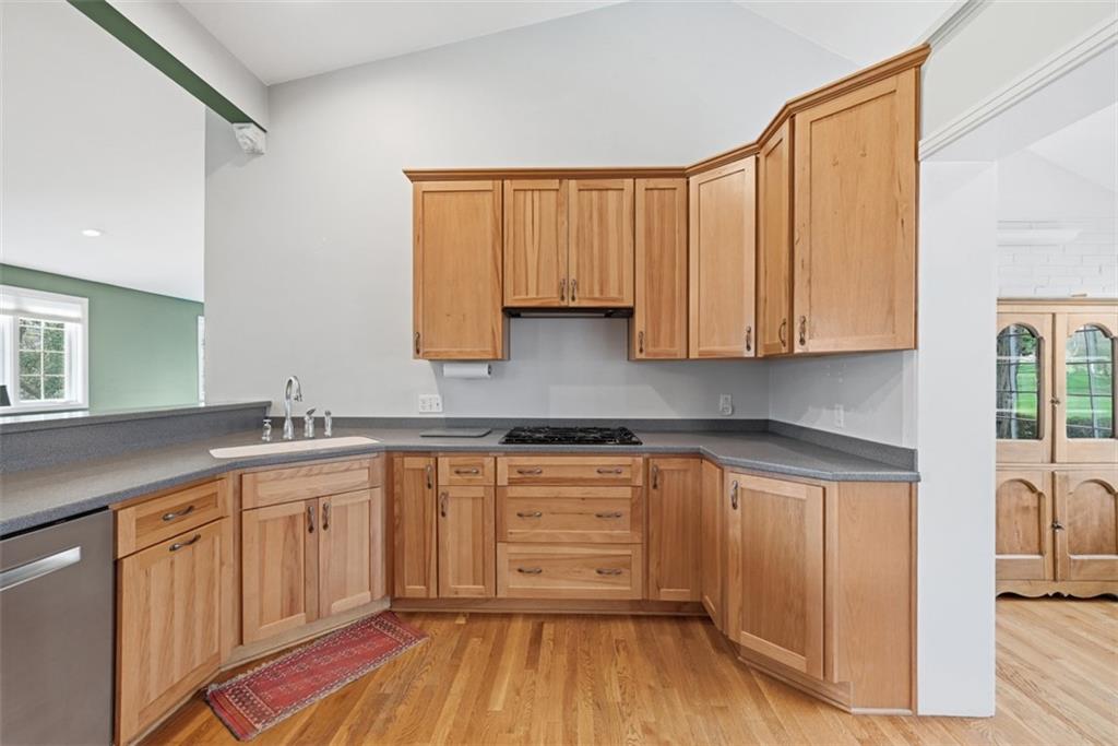 1001 Fox Chapel Road Pittsburgh, PA 15238 - Photo 13 of 50 a kitchen with a sink window and cabinets