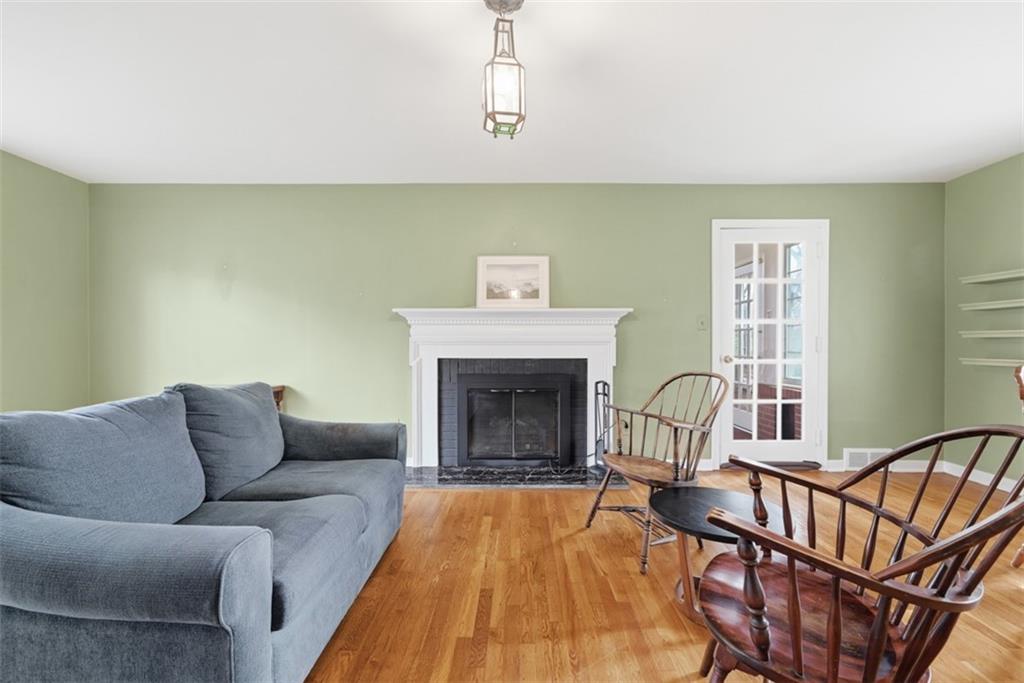 1001 Fox Chapel Road Pittsburgh, PA 15238 - Photo 27 of 50 a living room with furniture and a fireplace