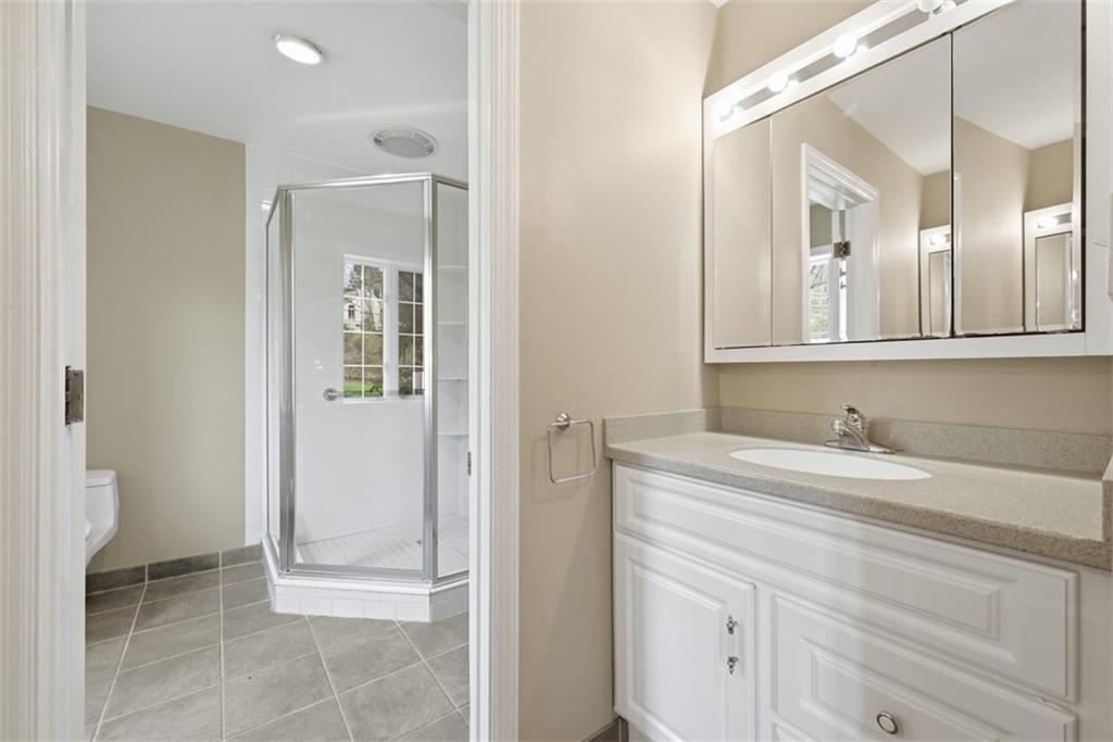 1001 Fox Chapel Road Pittsburgh, PA 15238 - Photo 37 of 50 a bathroom with a sink and a mirror