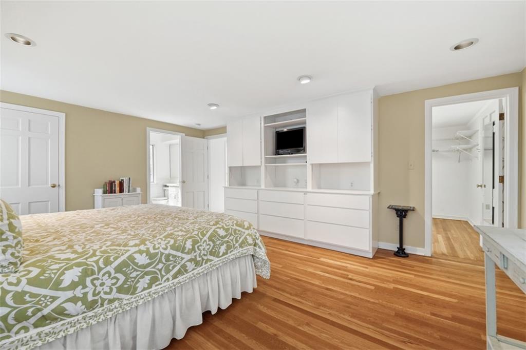 1001 Fox Chapel Road Pittsburgh, PA 15238 - Photo 39 of 50 a bedroom with a bed and a flat tv screen on dresser